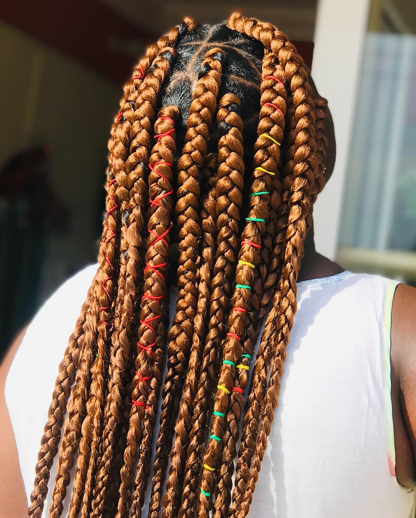 Vibrant Long Jumbo Braids with Colorful Thread Accents
