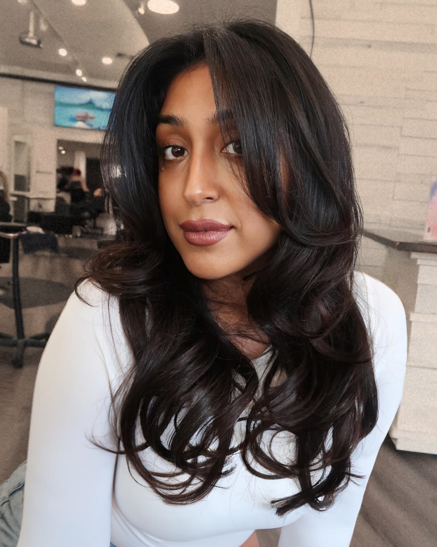 Elegant Long Layers with Soft Face-Framing Bangs