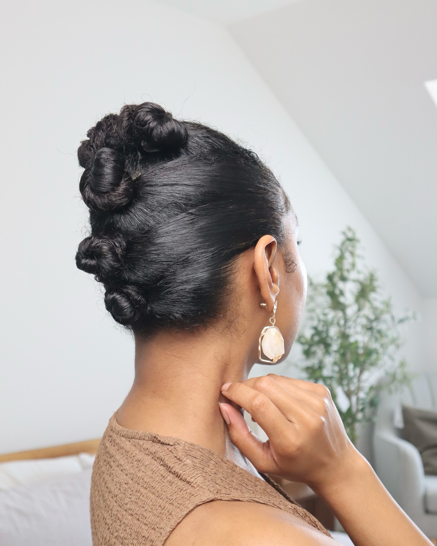 Elegant Twisted Coily Bun with Defined Accents