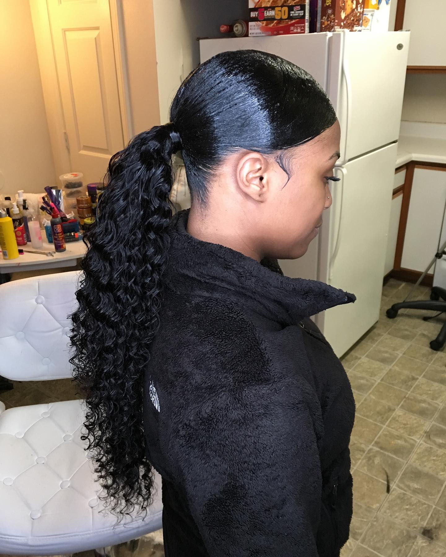 Sleek High Coily Ponytail with Defined Curls