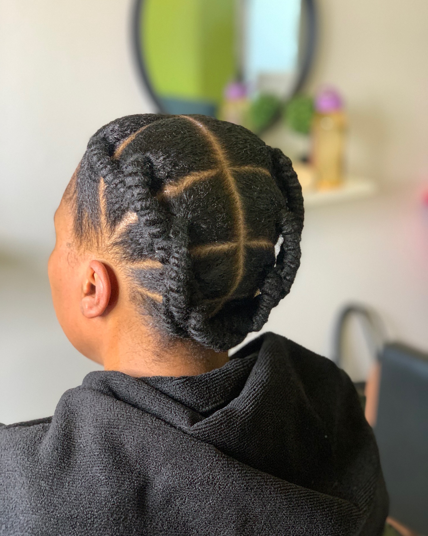 Stylish Double Twisted Coily Updo with Defined Sections