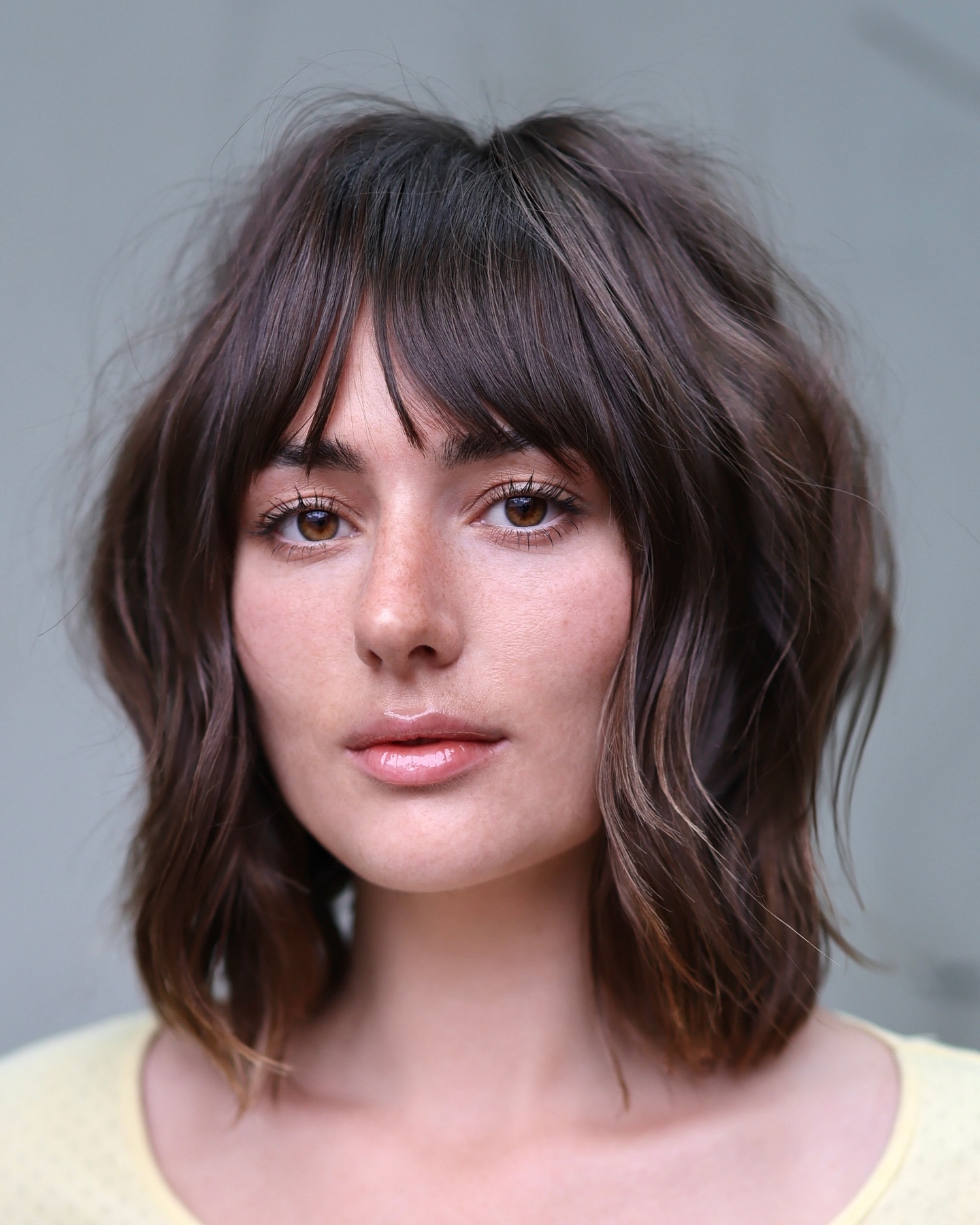Chic Textured Brow-Skimming Bangs with Soft Beachy Waves