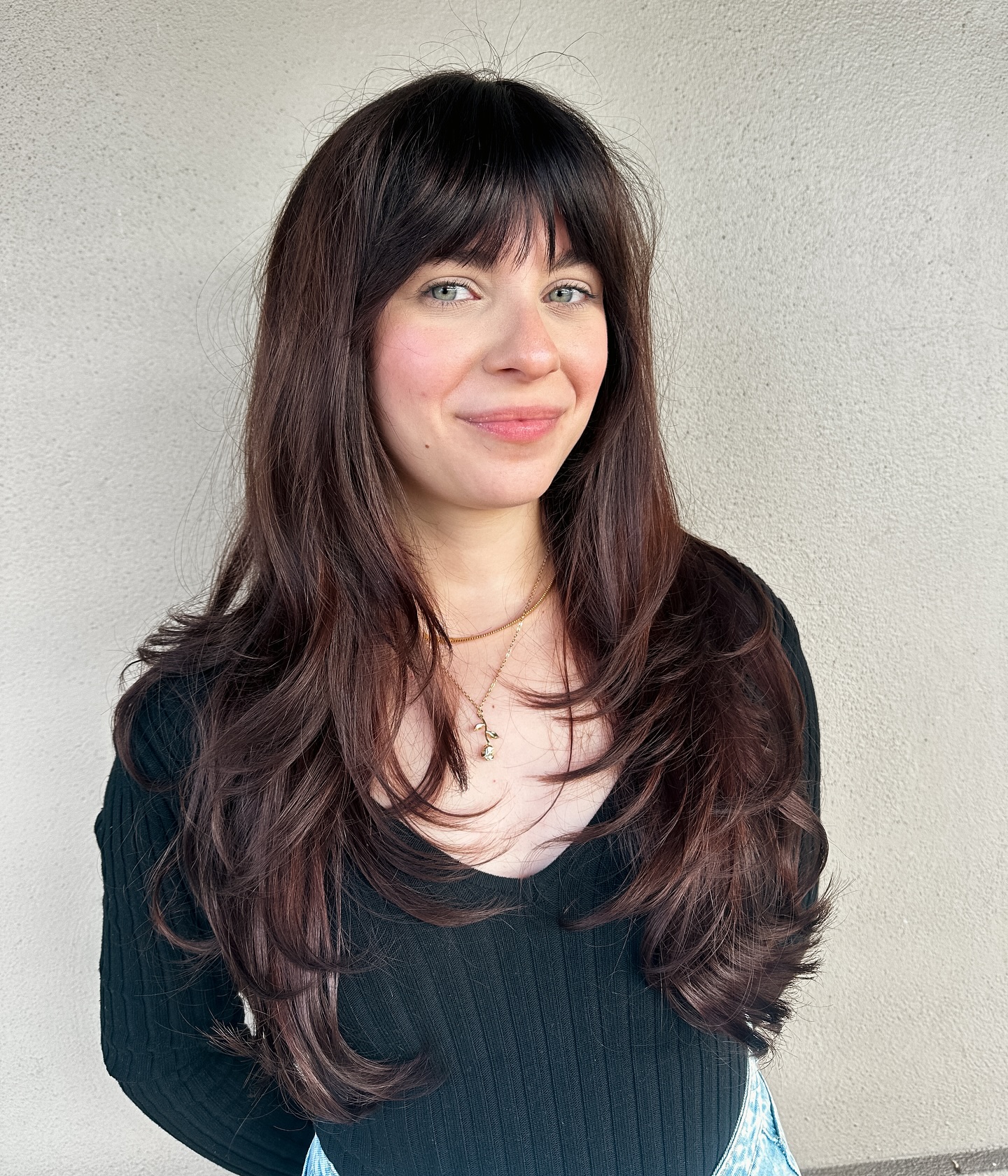 Stylish Brow-Skimming Bangs with Long Layers