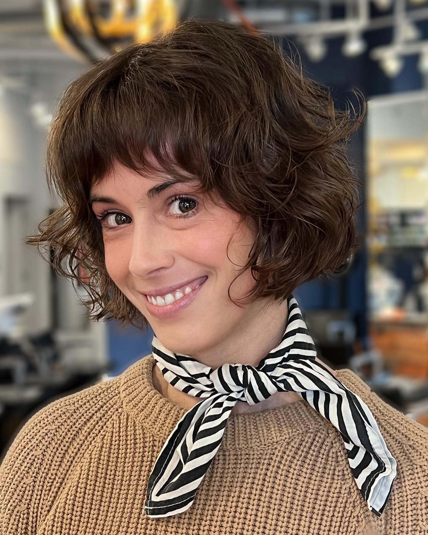 Chic Curly Bob with Playful Bangs