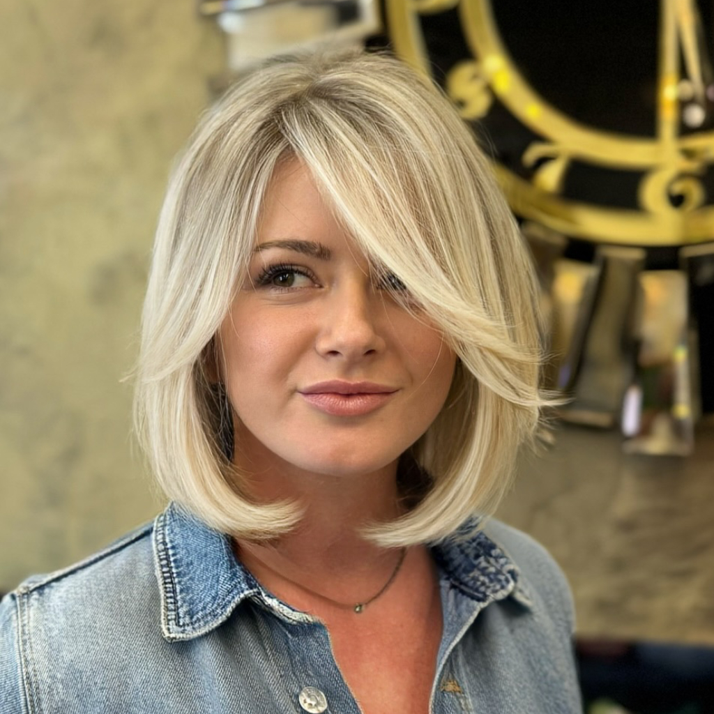 Stylish Layered Blonde Cut with Bold Side Bangs