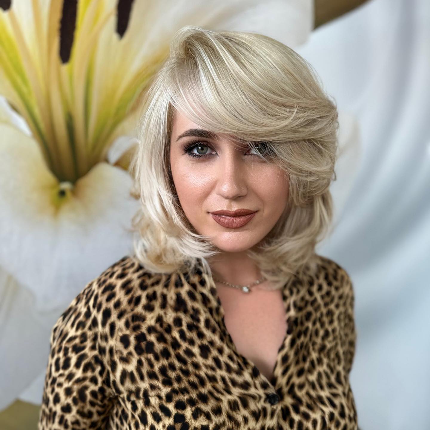 Textured Blonde Lob with Dramatic Side Bangs