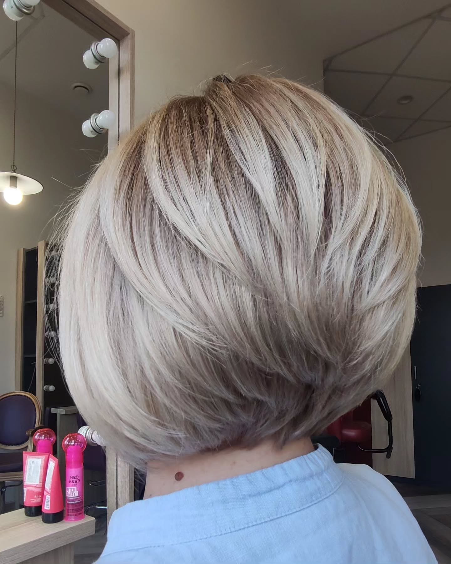 Sleek Feathered Bob with Subtle Caramel Balayage