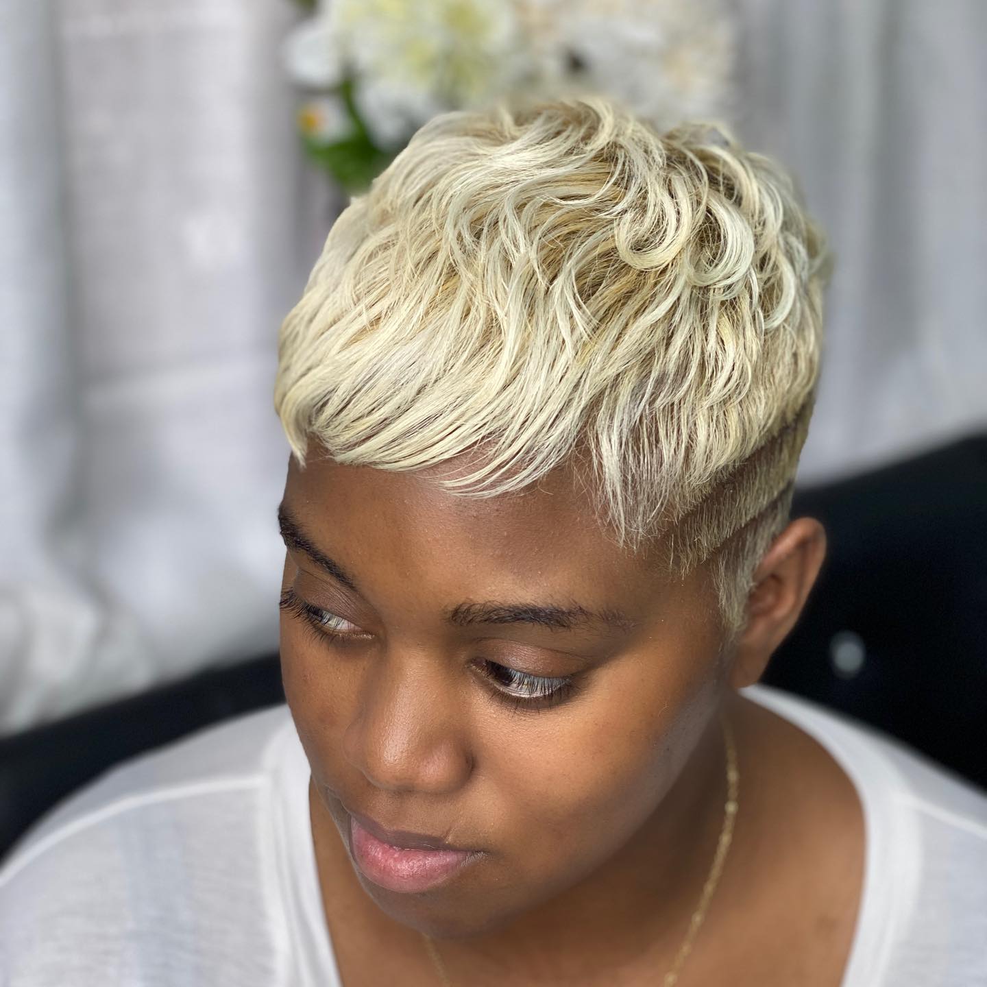 Chic Textured Platinum Pixie Cut with Undercut