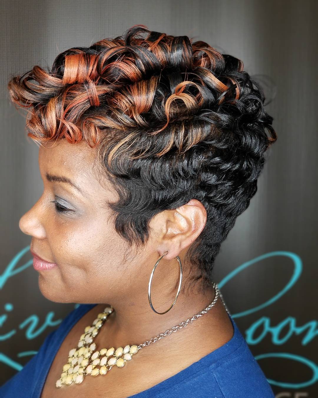Dynamic Curly Tapered Cut with Rich Highlights