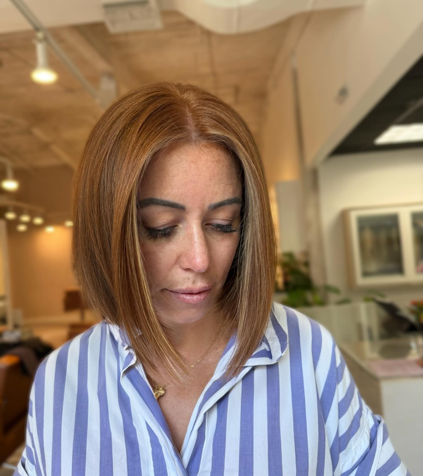 Warm Chestnut Angular Bob with Subtle Highlights