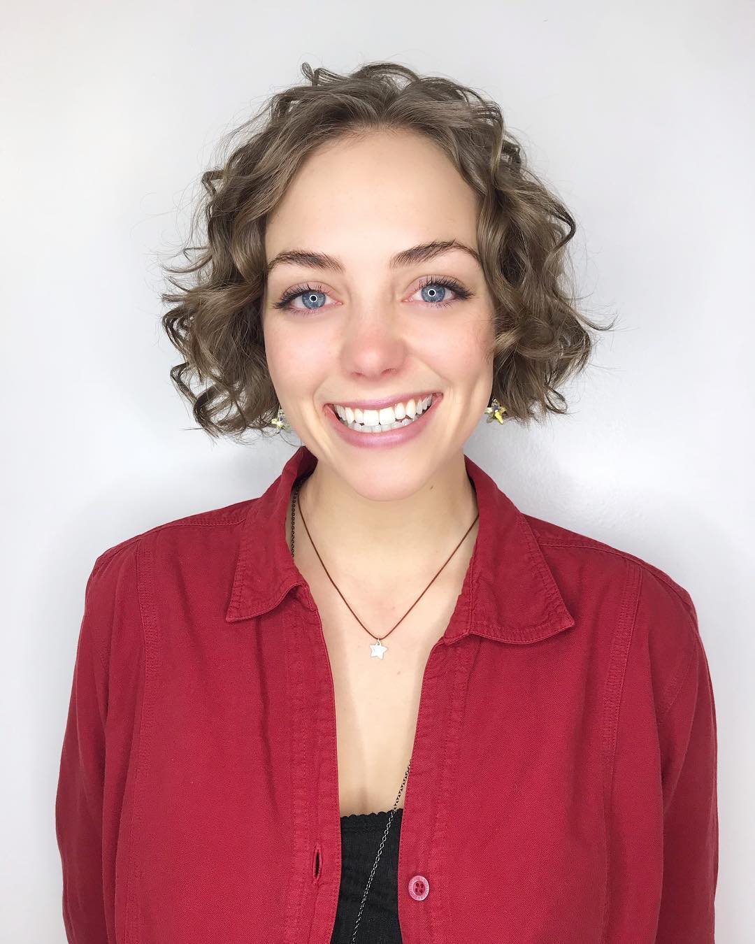 Playful Curly Jaw-Length Bob with Subtle Texture