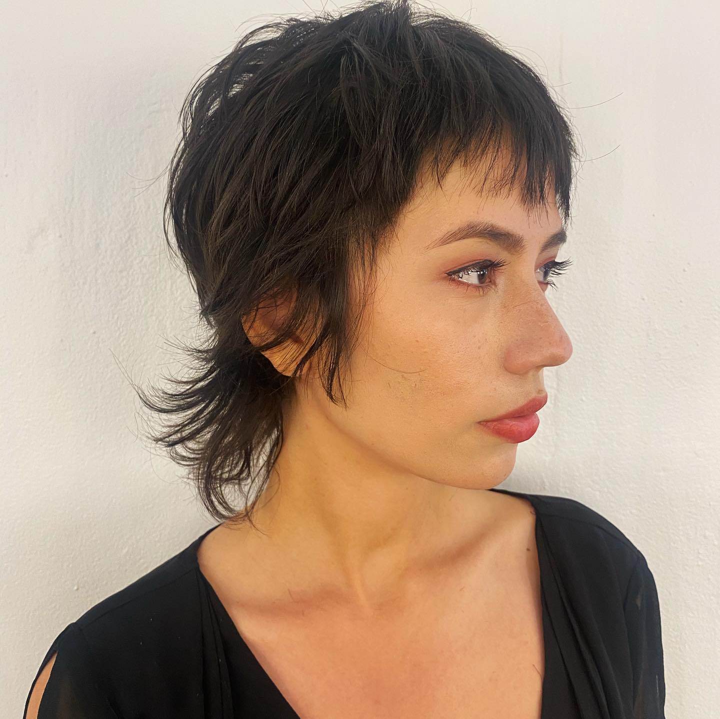 textured short shag with wispy bangs