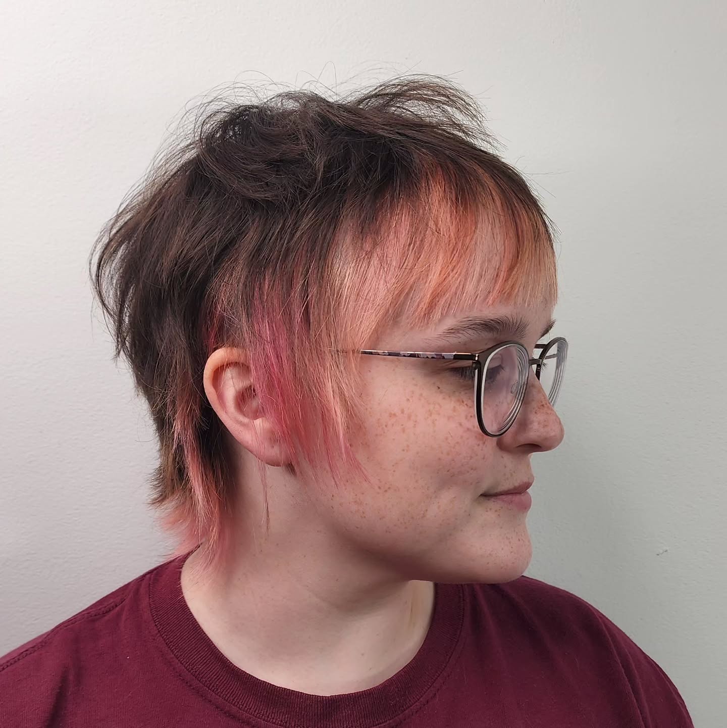 Trendy Textured Bixie Cut with Subtle Pink Highlights