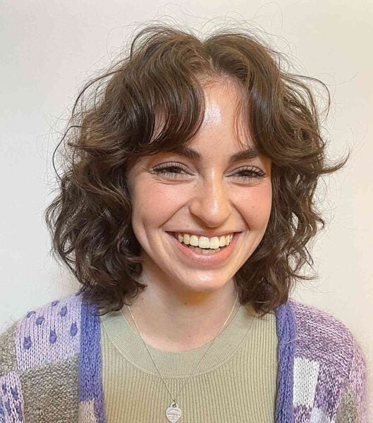 Chic Curly Face-Framing Bob with Soft Bangs