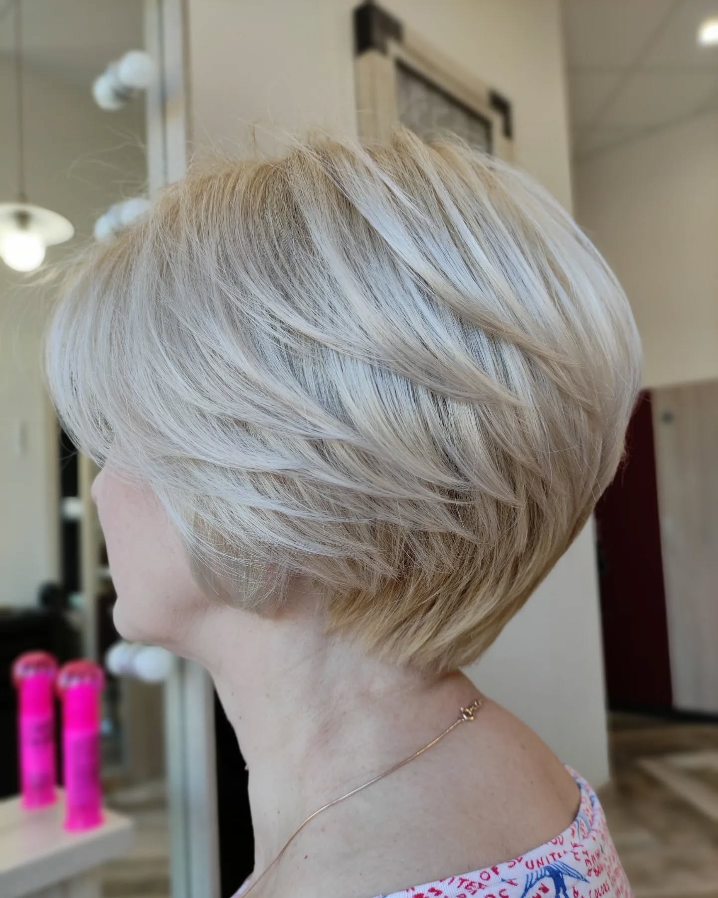 chic light blonde feathered bob with subtle layers