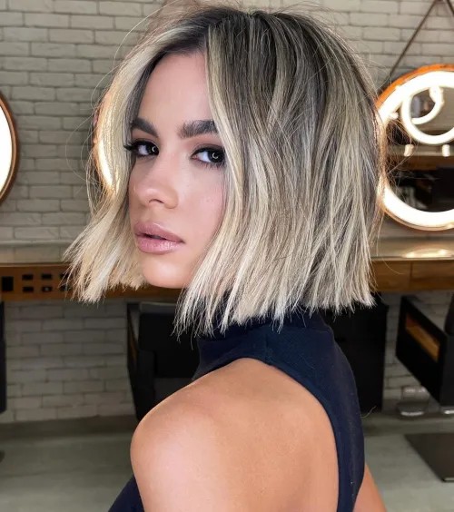 Choppy Middle Part Bob with Sun-Kissed Highlights