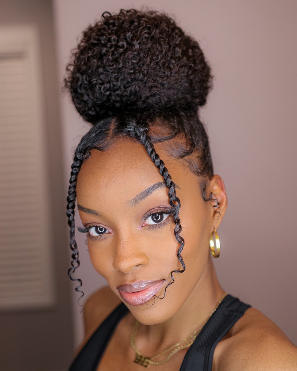 Elegant Curly Bun with Twisted Accents