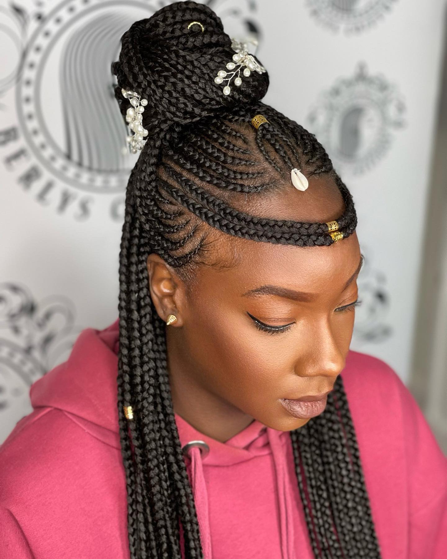 Elegant High Braided Bun with Decorative Accents