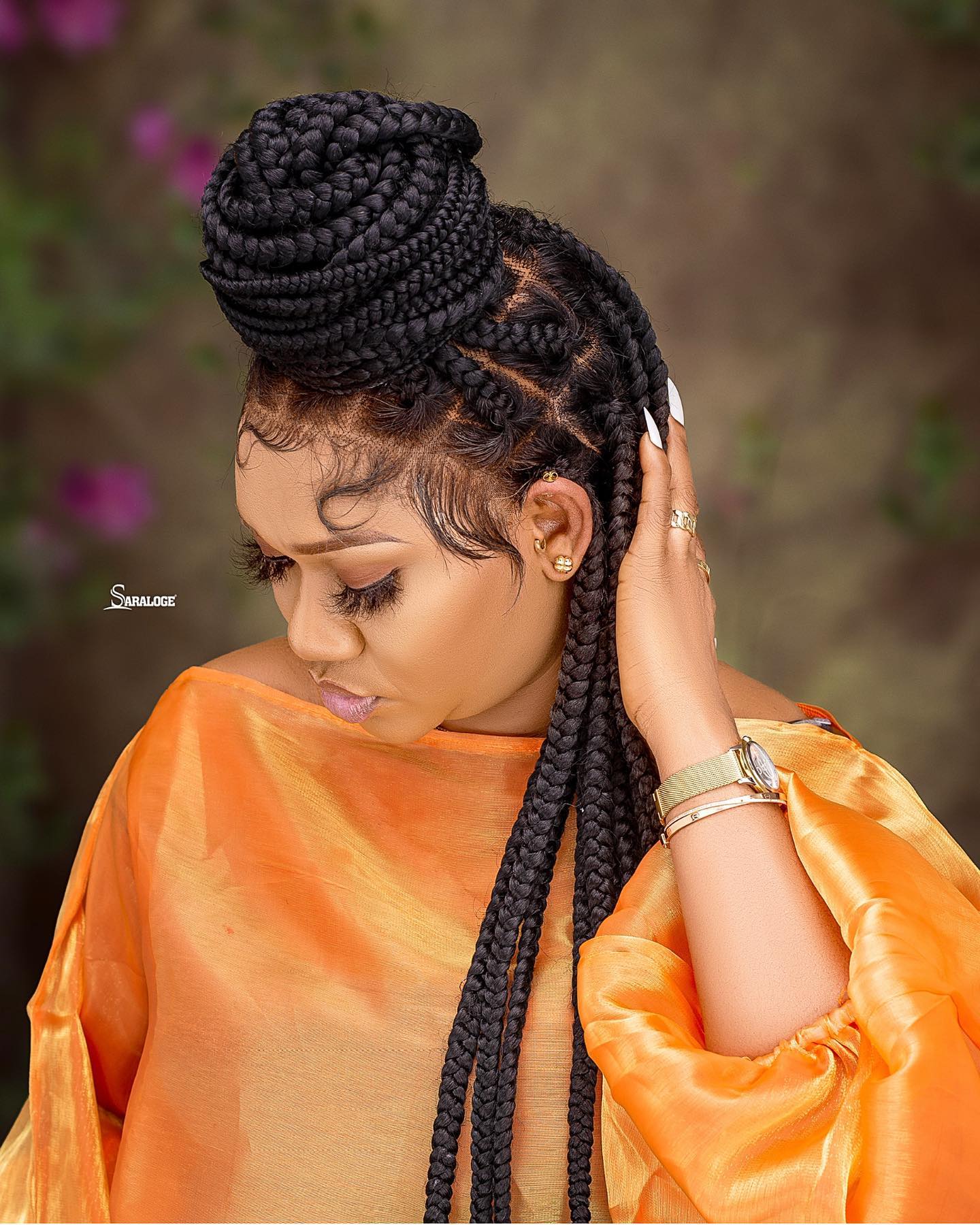 Elegant High Braided Bun with Defined Edges