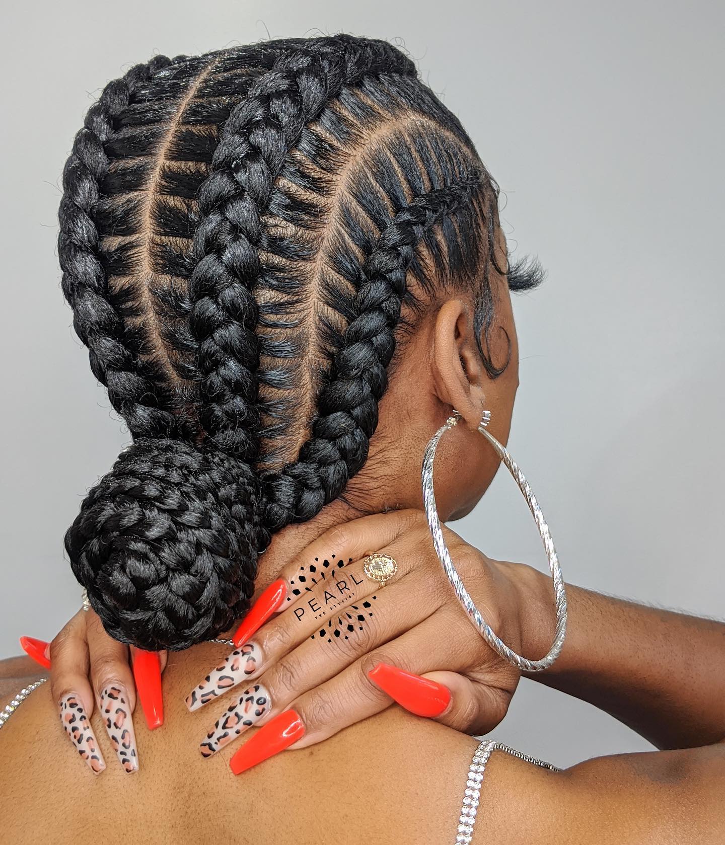 Intricate Braided Bun with Defined Cornrows