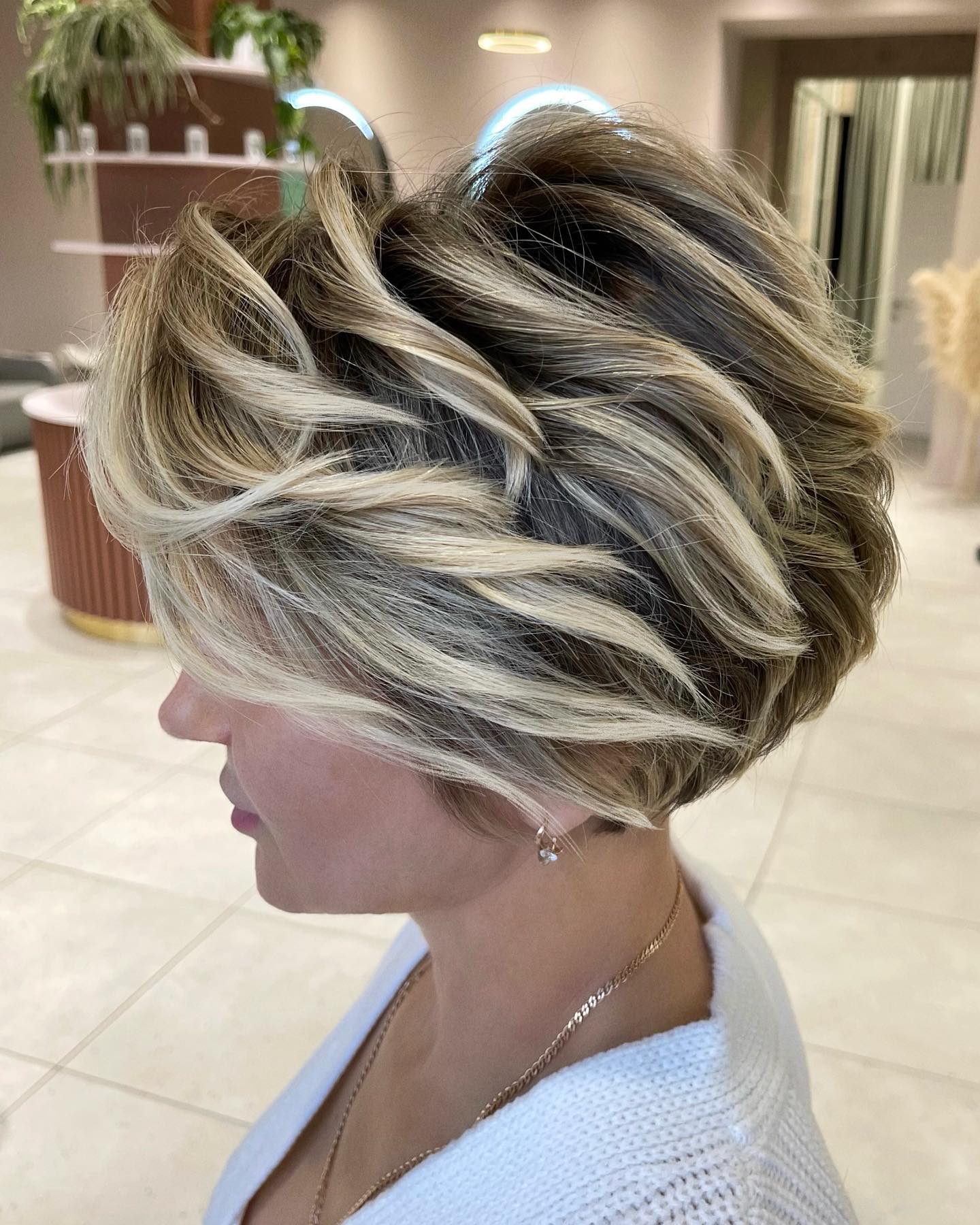 Modern Textured Feathered Bob with Subtle Highlights
