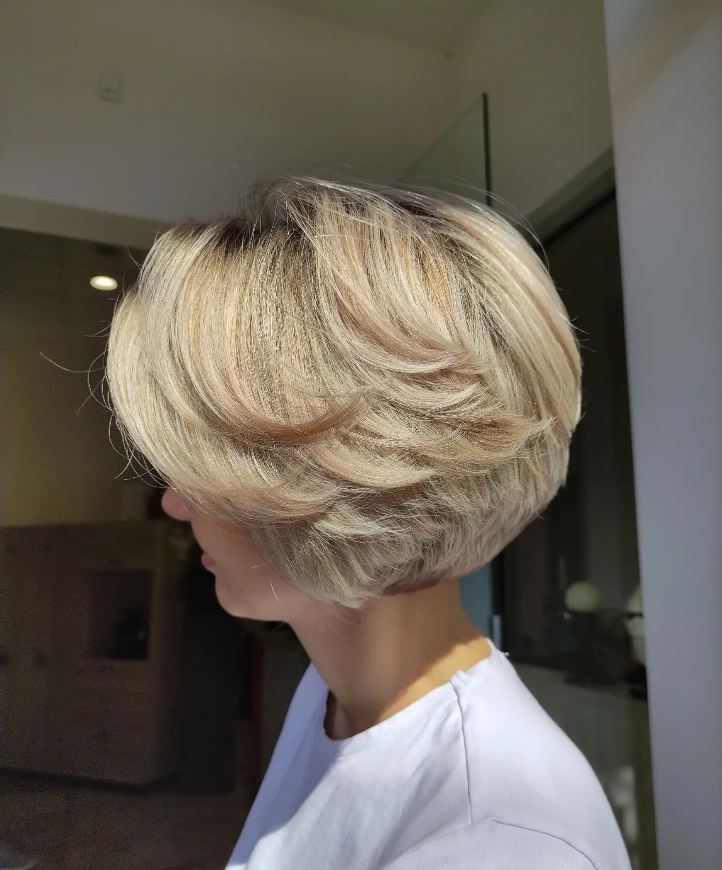 Softly Feathered Blonde Bob with Subtle Dimension