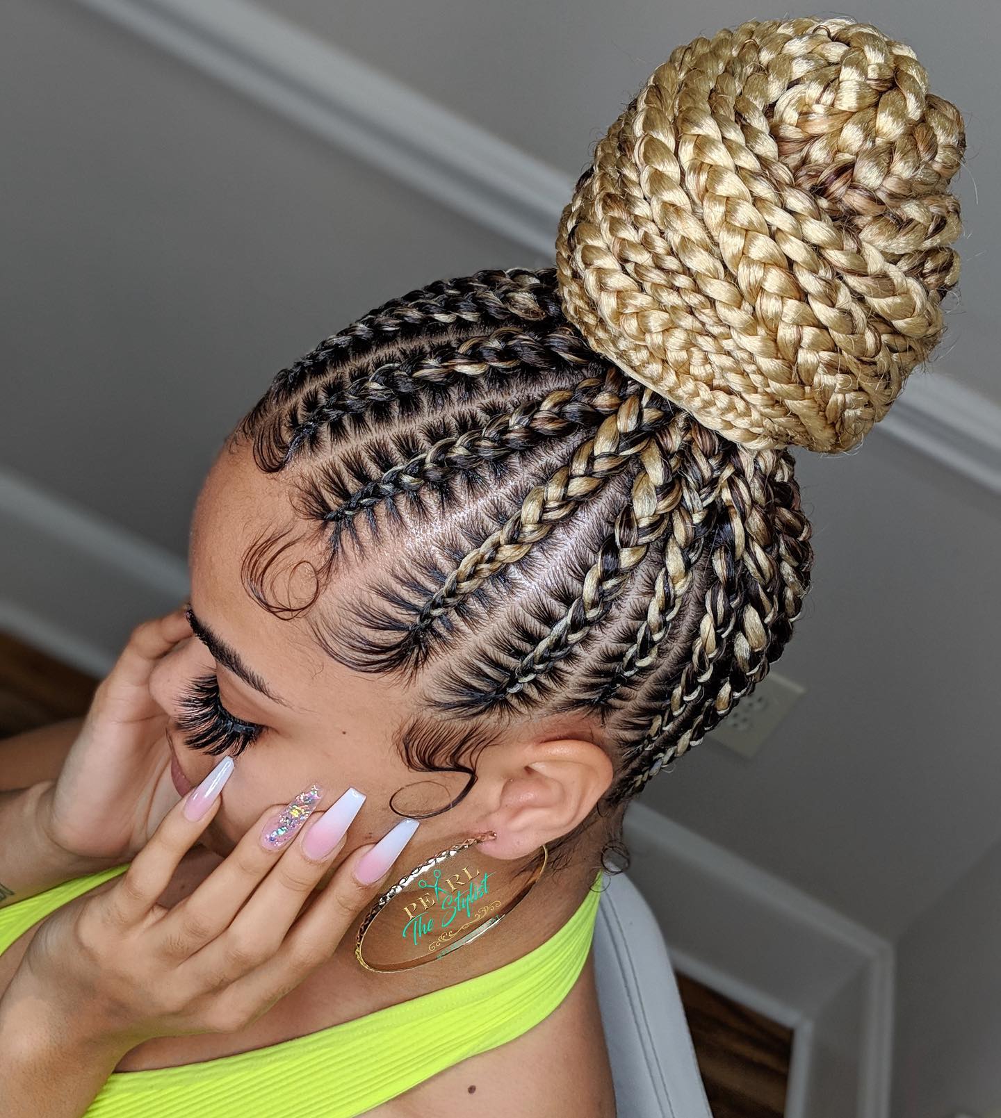 Stylish Braided Bun with Defined Baby Hairs