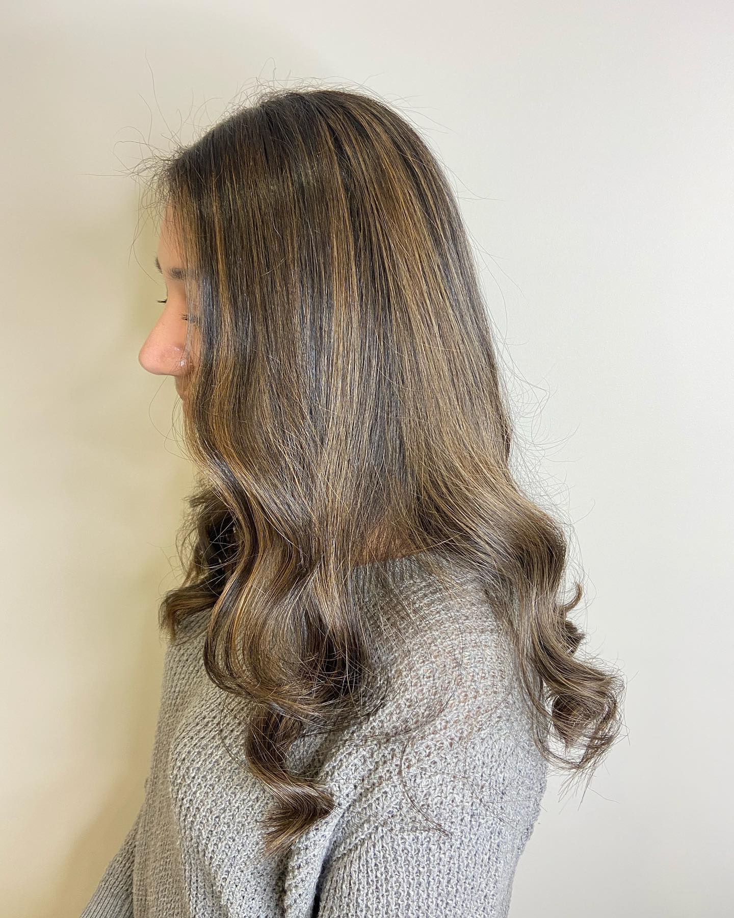 chic long layered waves with light brown highlights