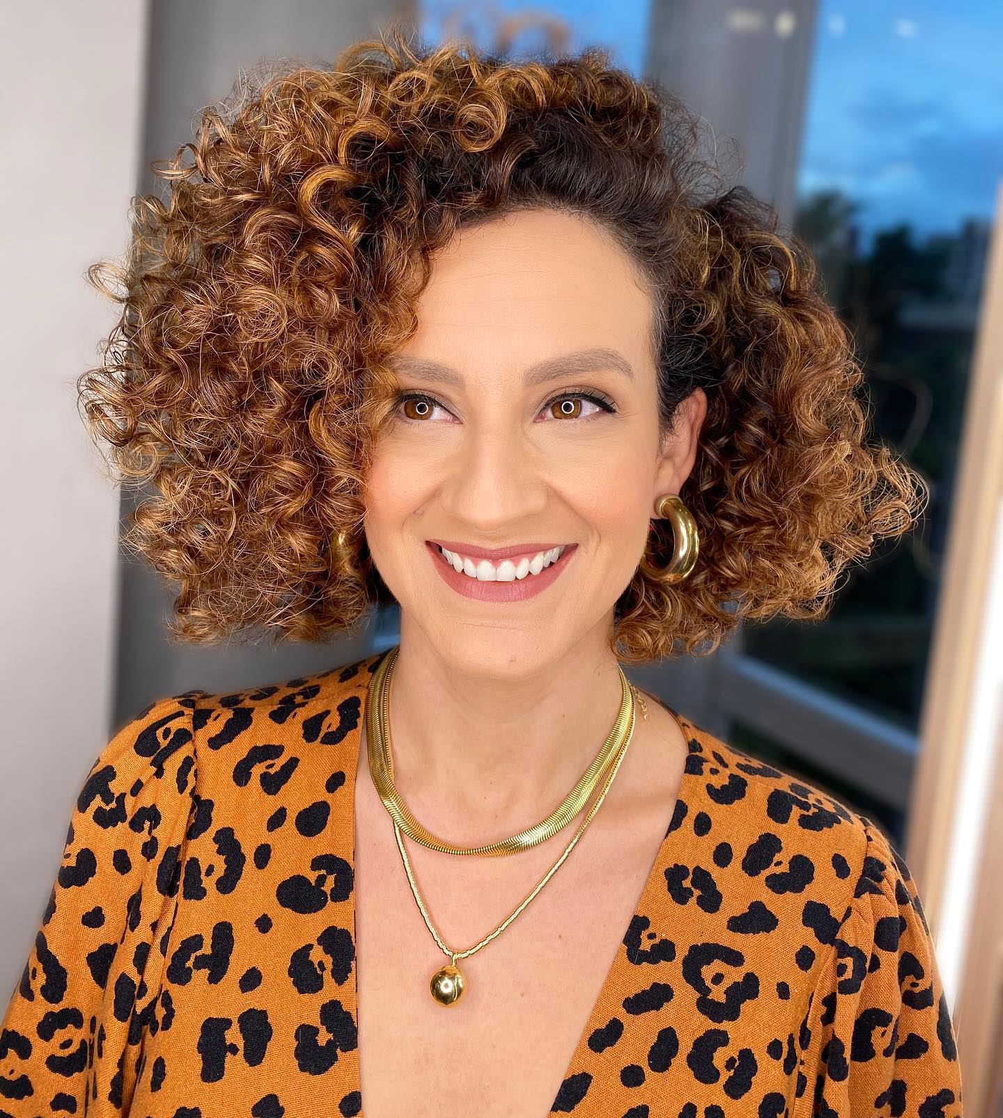 dynamic curly bob with side part