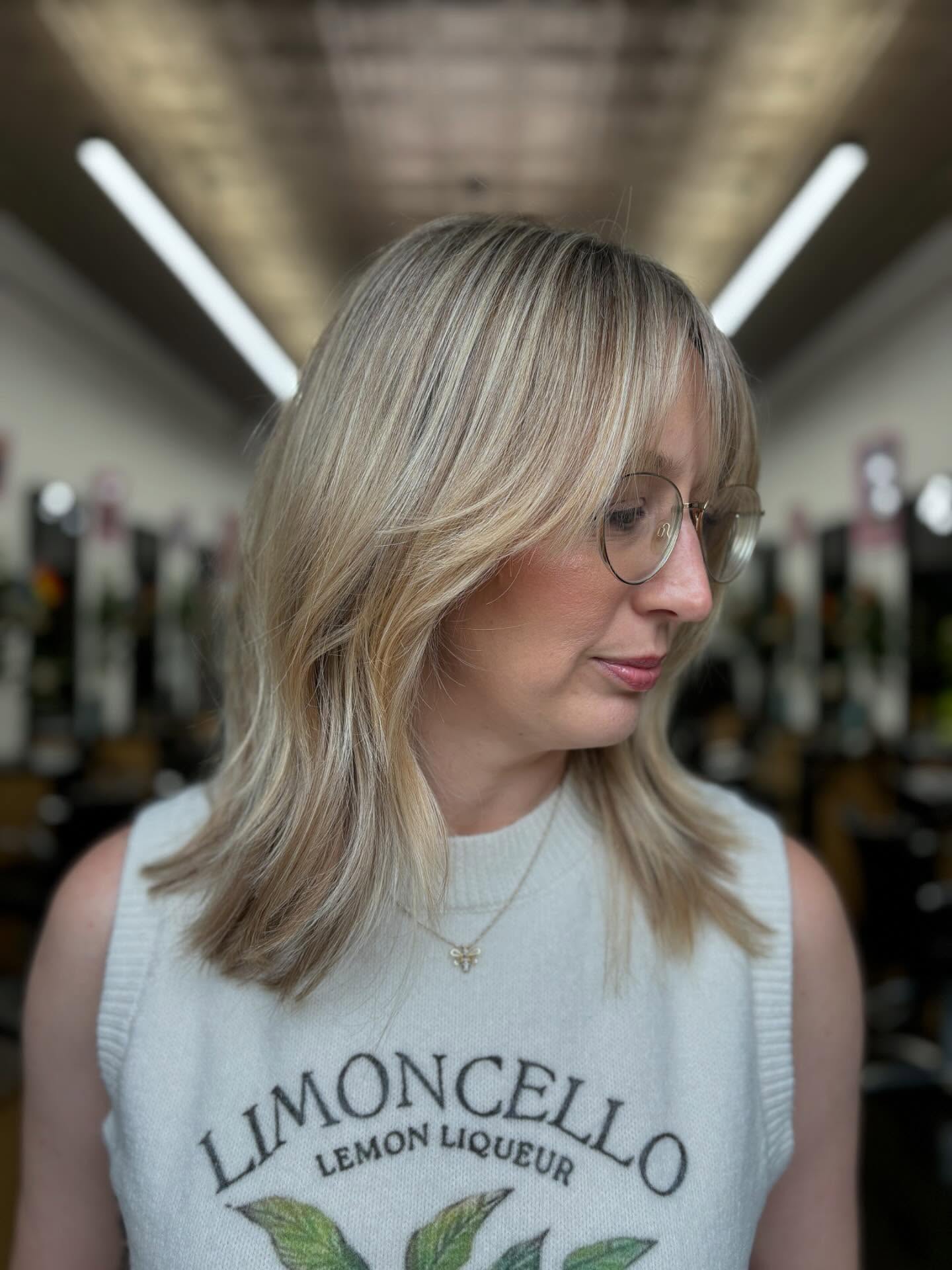 Soft Layered Blonde Cut with Gentle Face-Framing Highlights