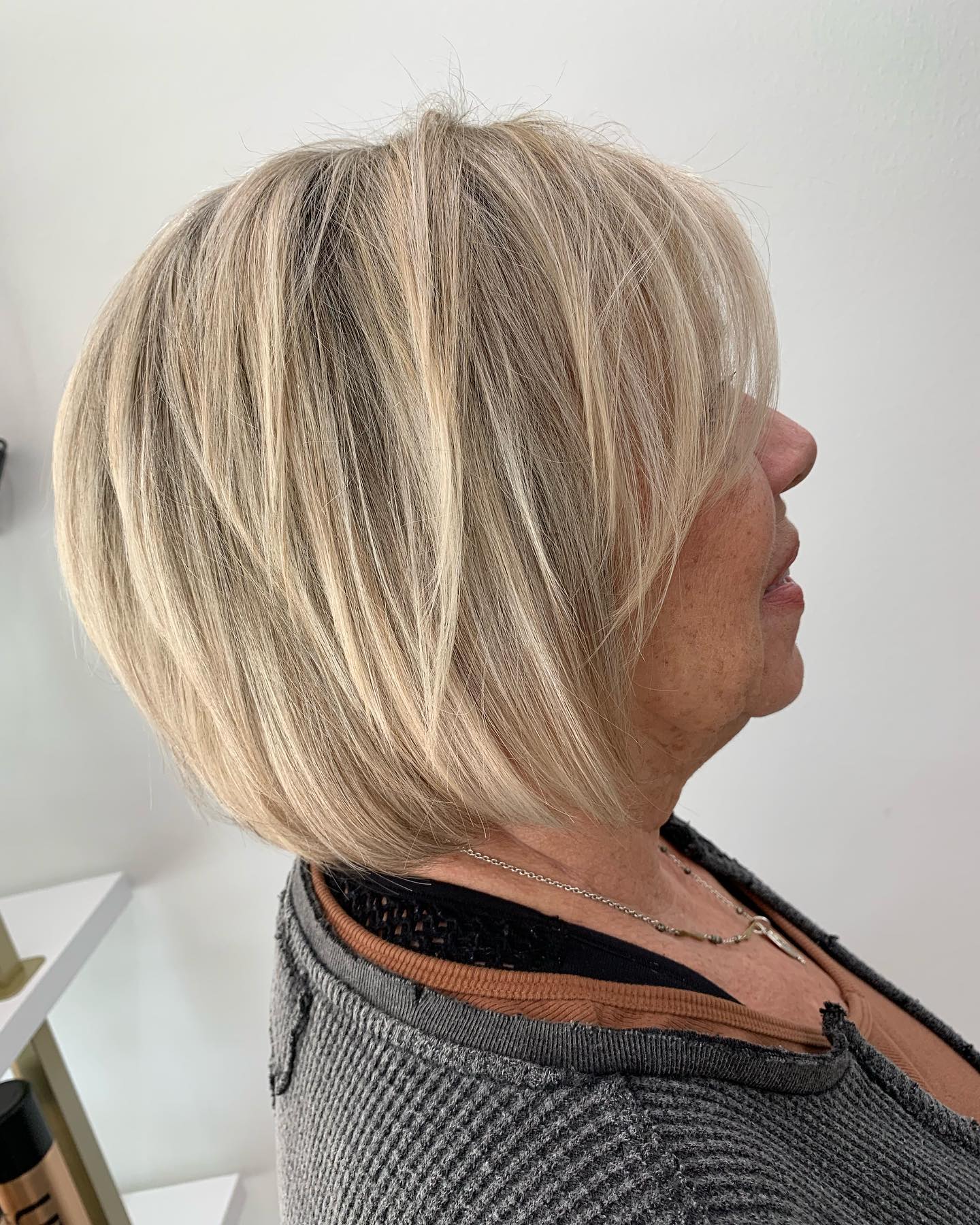 Textured Ash Blonde Bob with Subtle Face-Framing Layers