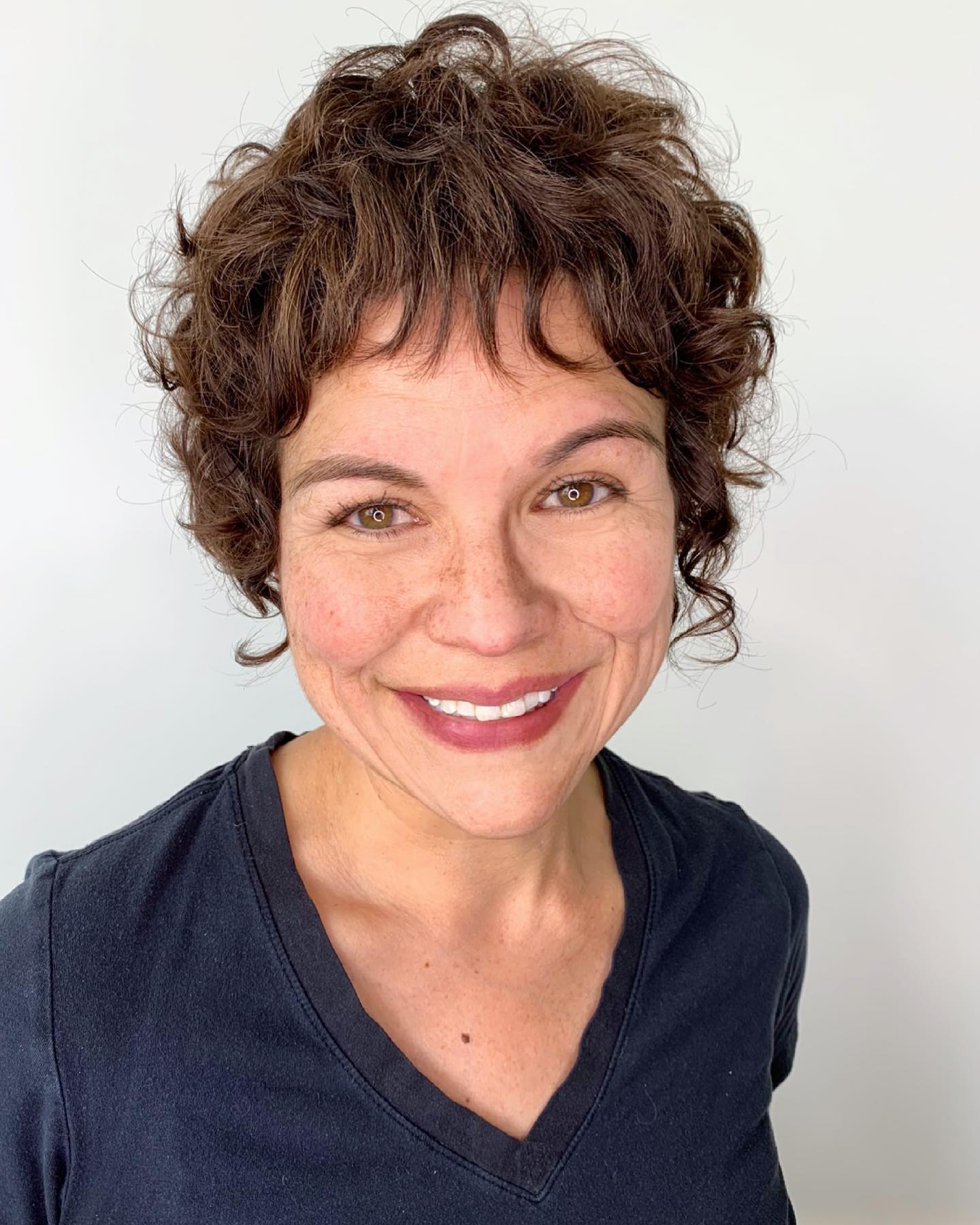 Textured Curly Pixie Cut with Subtle Layers