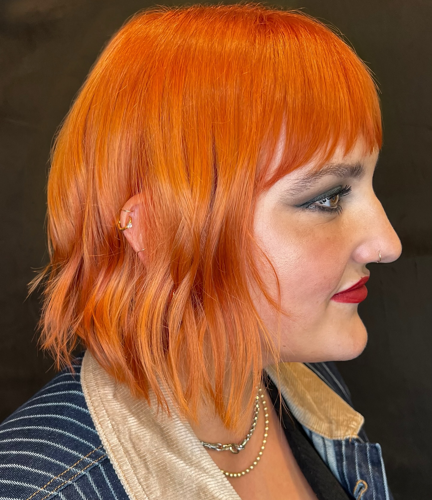 Vibrant Textured Frayed Bob with Wispy Bangs