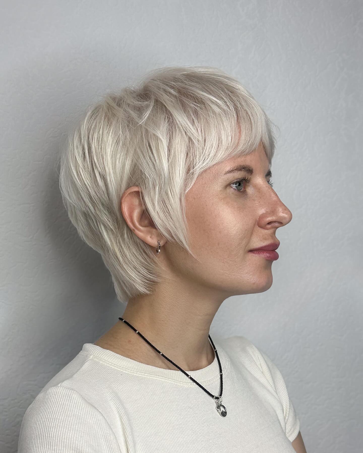 Stylish Short Feathered Pixie with Subtle Highlights