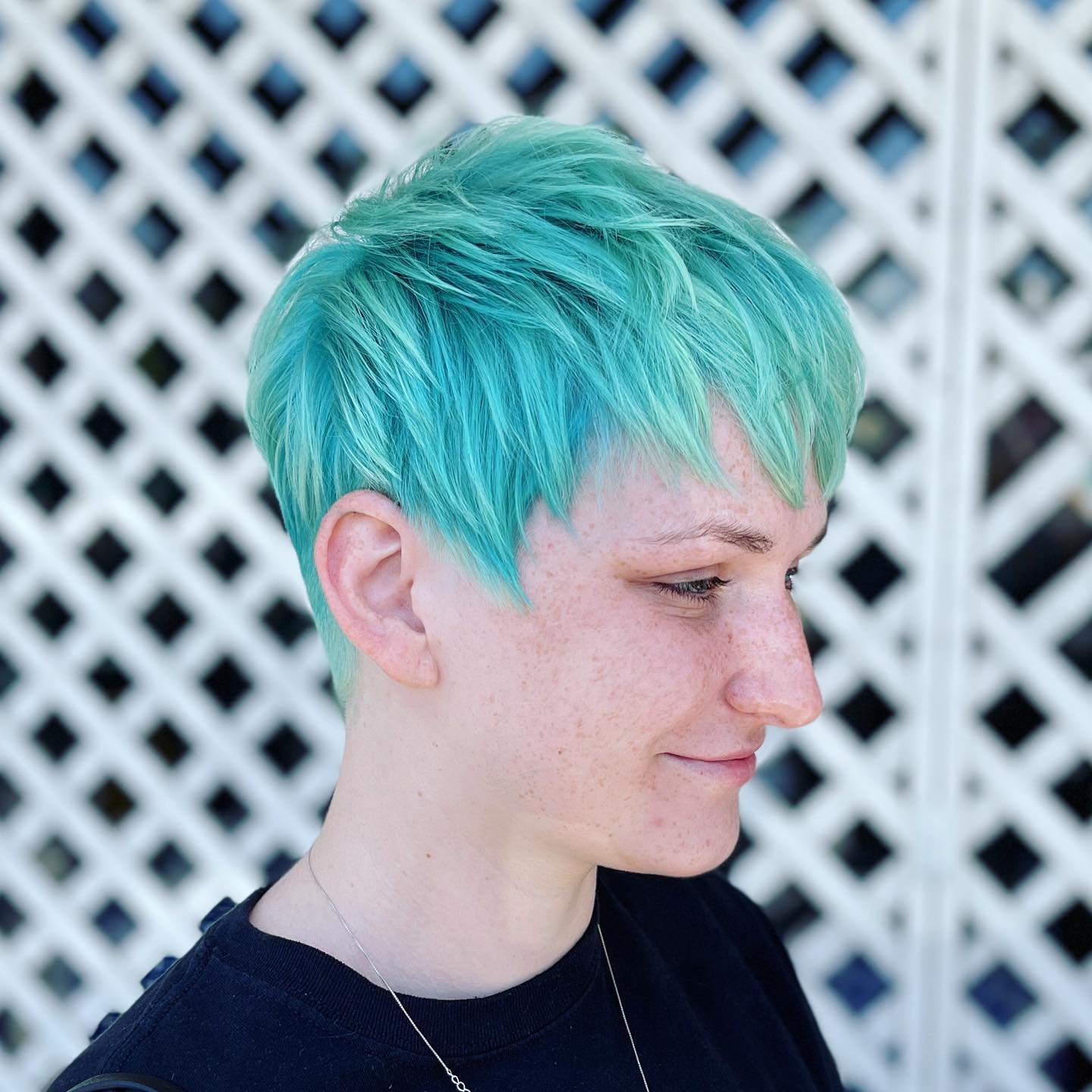 Vibrant Teal Layered Pixie Cut