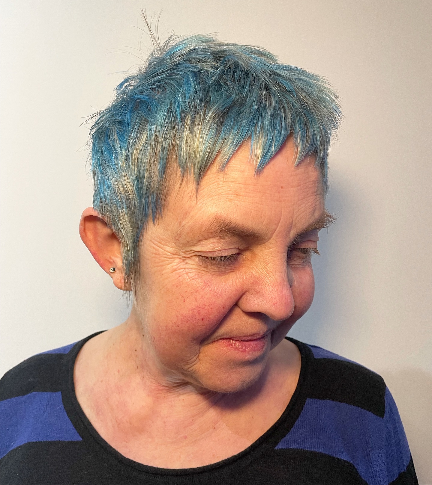 Vibrant Textured Pixie Cut with Bold Blue Highlights