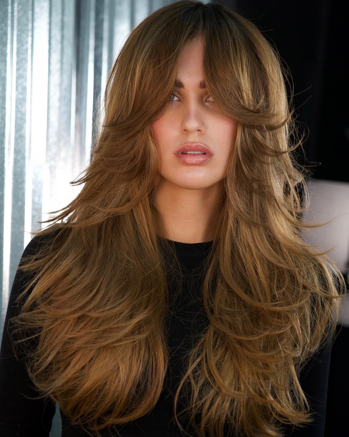 Voluminous Layered Cut with Soft Face-Framing Strands