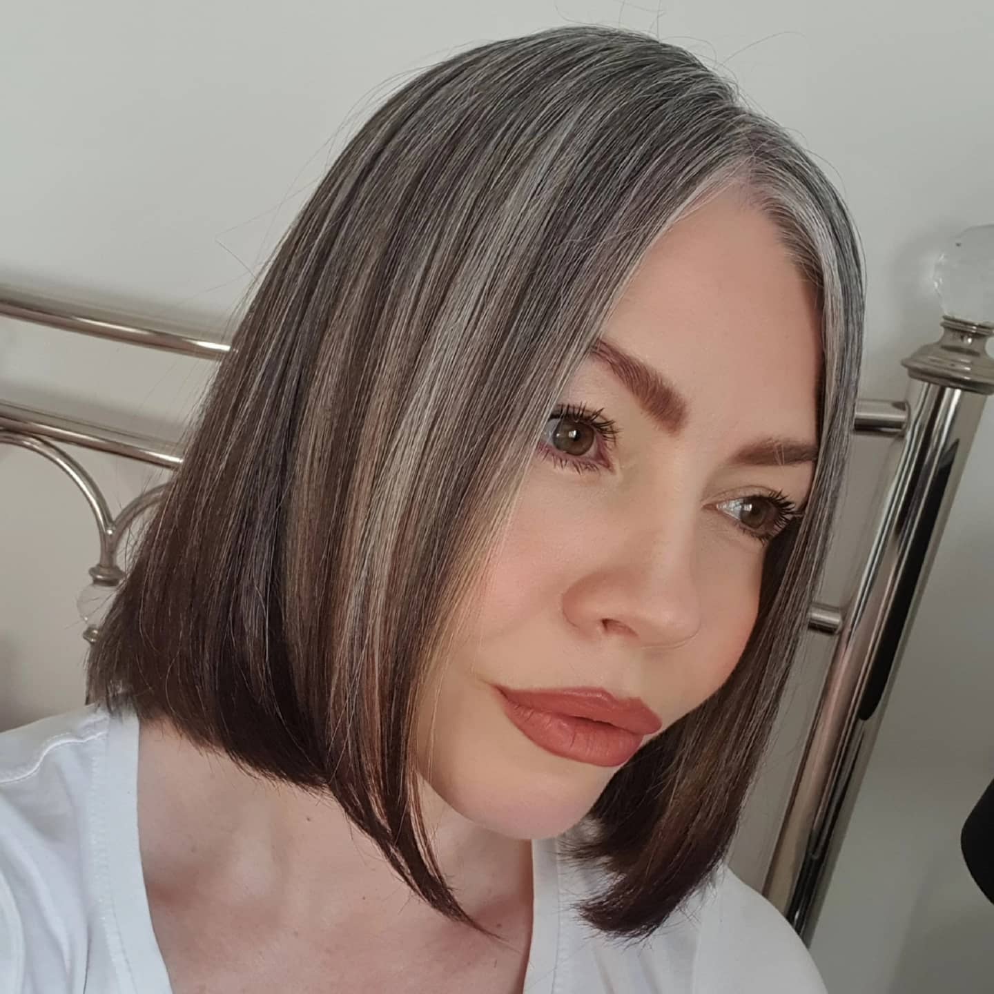 Chic Asymmetrical Grey Bob with Subtle Highlights