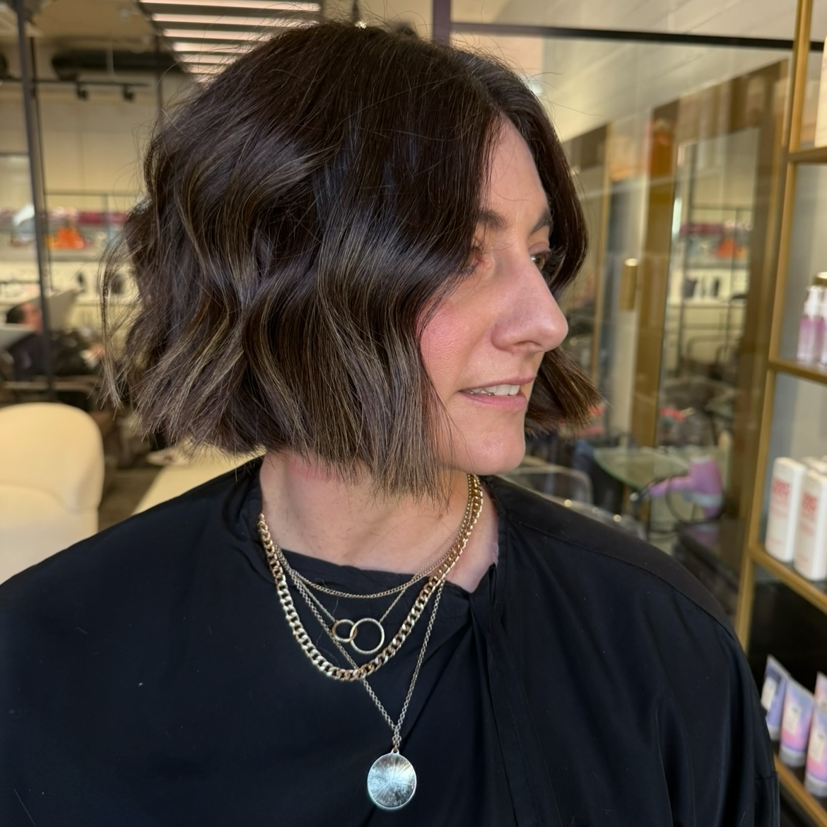 chic textured brunette bob with subtle highlights