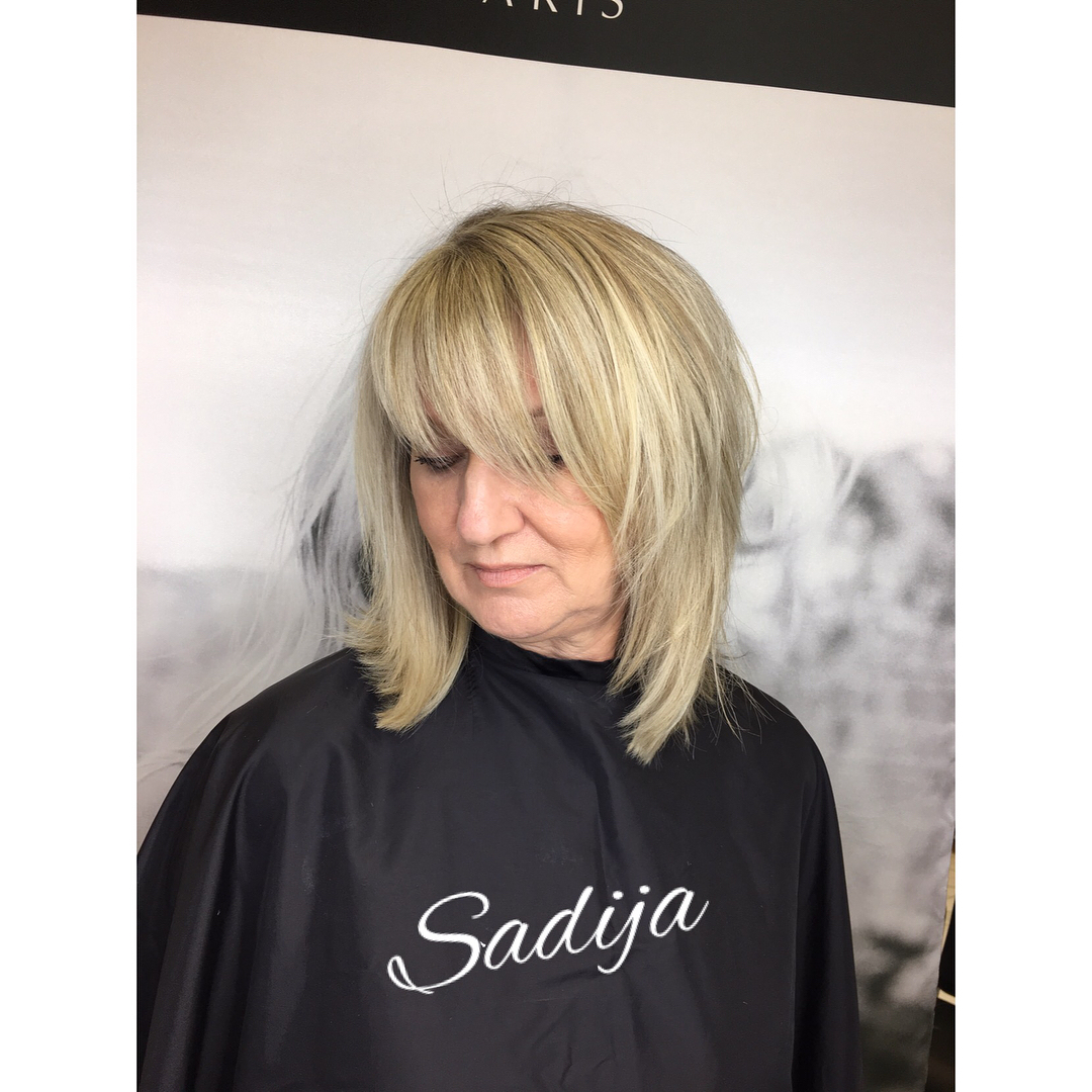 Softly Textured Shoulder-Length Bob with Wispy Bangs