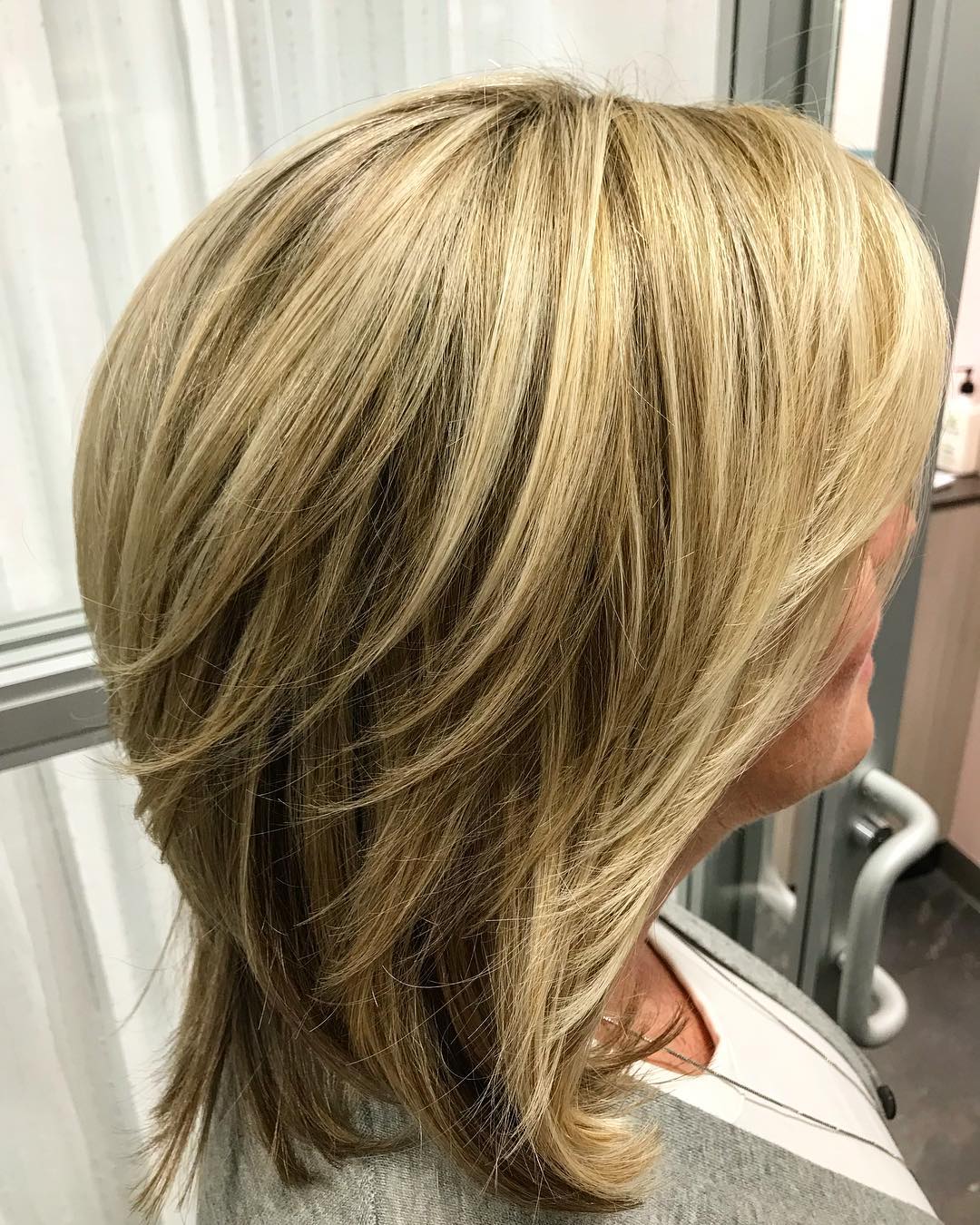 Textured Shoulder-Length Bob with Warm Blonde Balayage