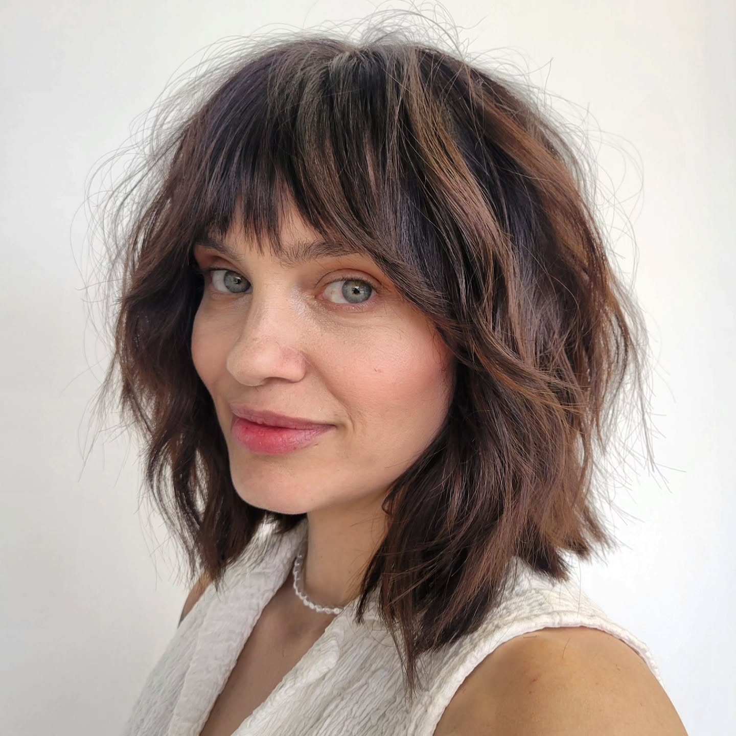 Textured Shoulder-Length Bob with Wispy Bangs