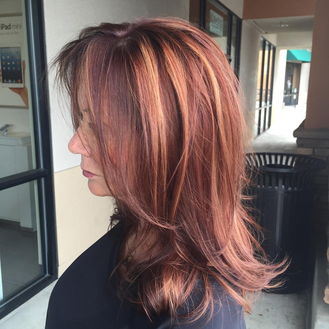 Warm Auburn Layered Shoulder-Length Bob with Subtle Highlights