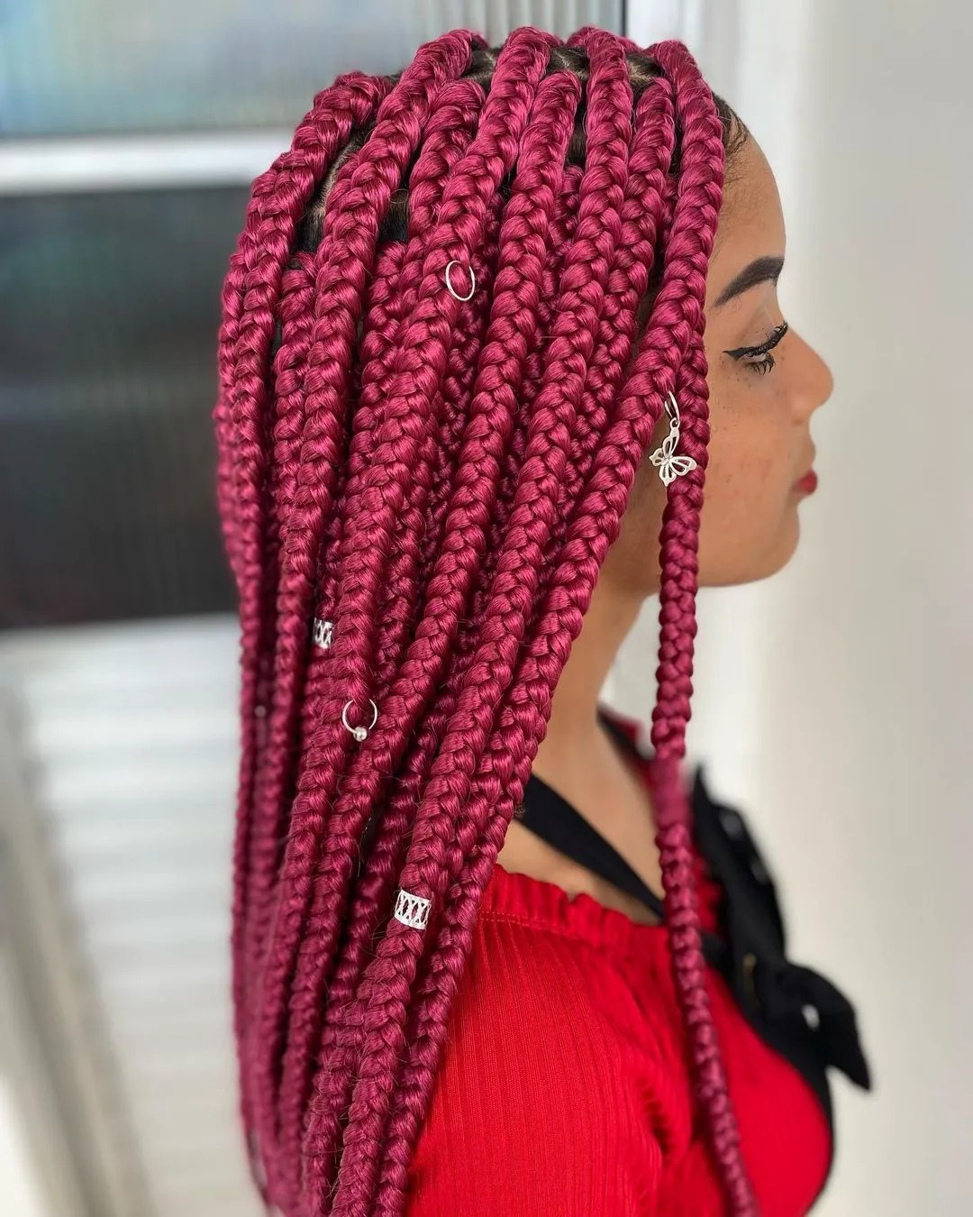 bold red box braids that stand out