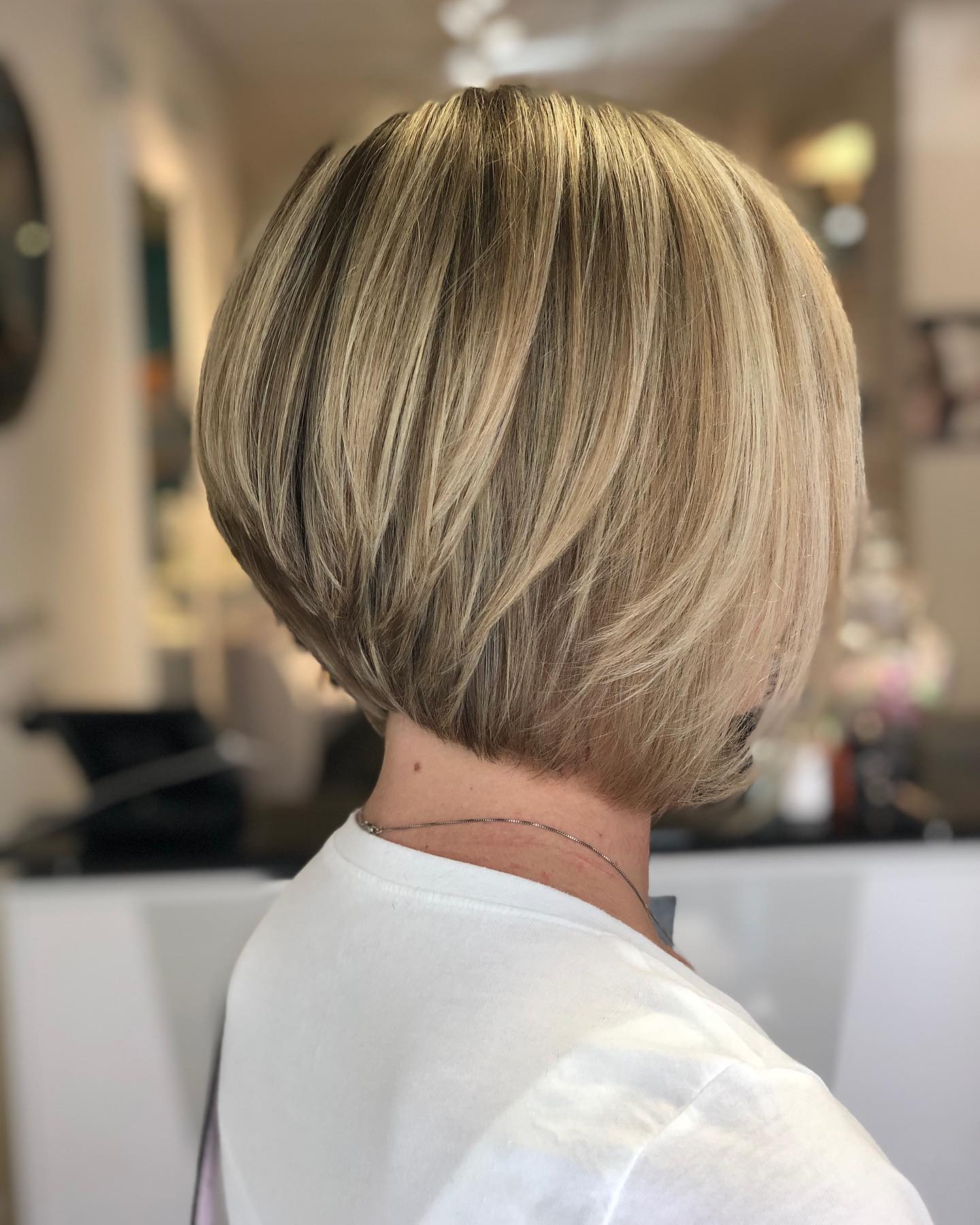 Beautifully Polished Stacked Bob with Sun-Kissed Highlights