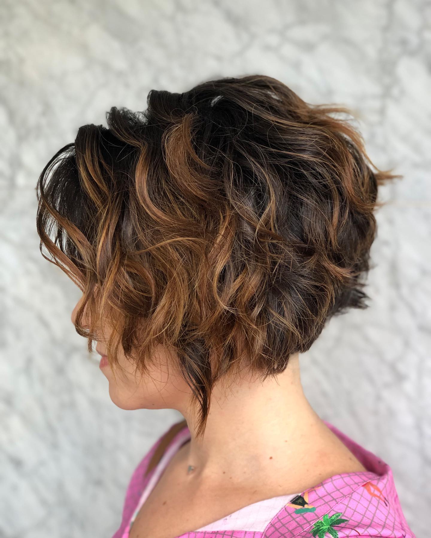 Dynamic Curly Stacked Bob with Rich Highlights