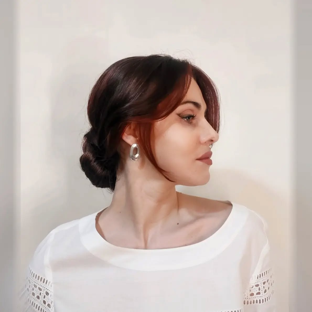 Elegant Low Chignon with Face-Framing Layers