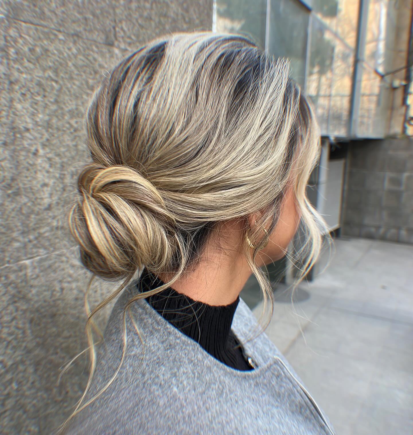 Elegant Twisted Low Bun with Soft Face-Framing Strands
