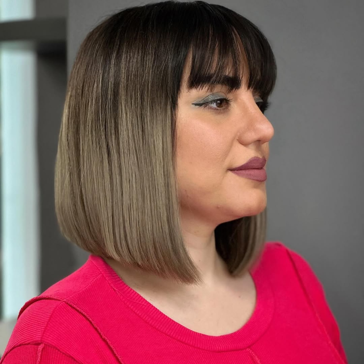Modern Sleek Neck-Length Bob with Full Bangs