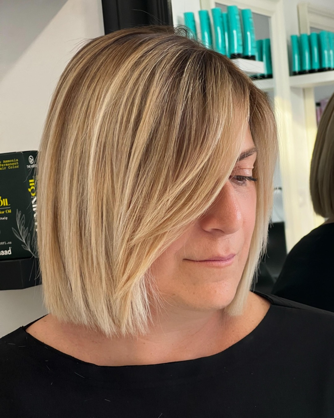 Softly Layered Neck-Length Bob with Side-Swept Bangs